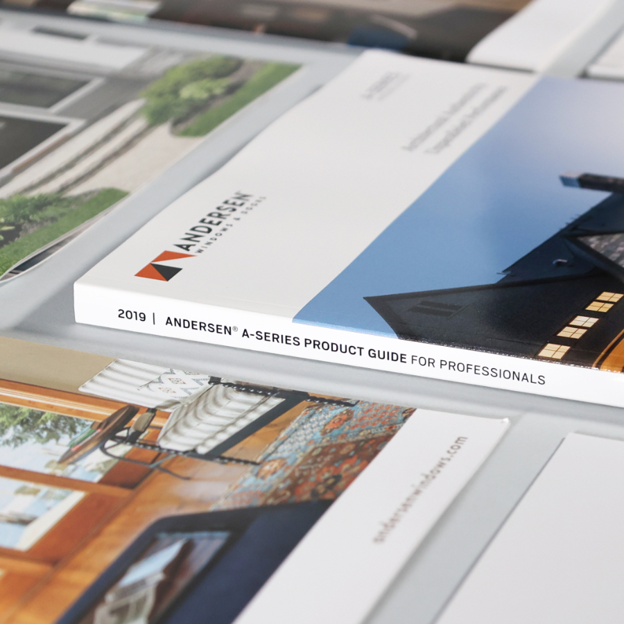 several andersen windows brochure covers showing a perfect bound spine