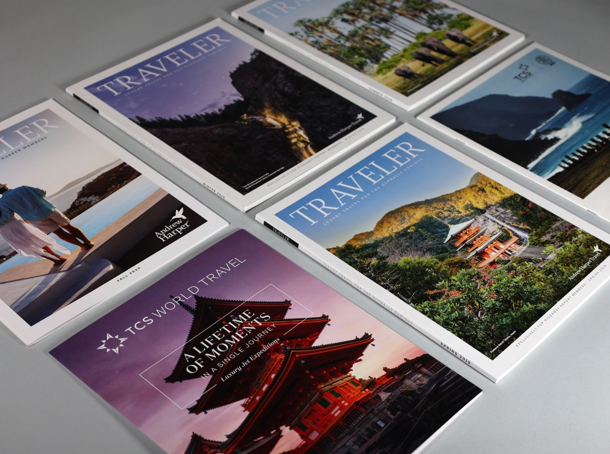 several travel brochure covers