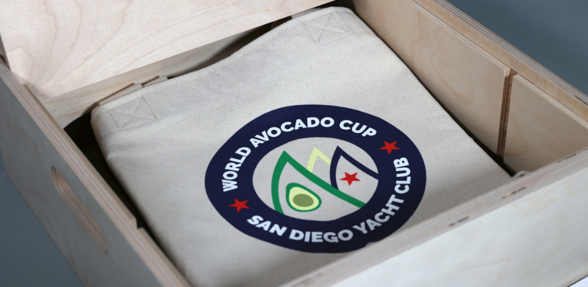 avocado box opened showing its contents, a canvas tote
